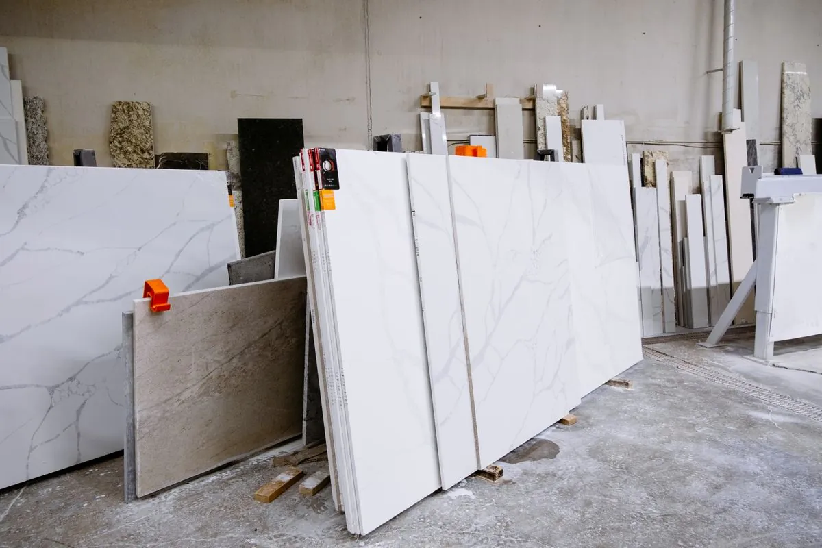 Granite and marble slabs stacked in a stone slab factory